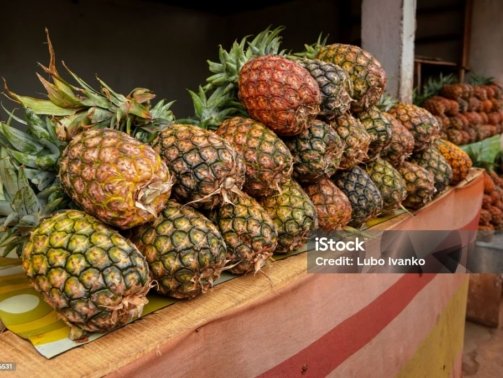 Pile of fresh pineapples on display at street market in Madagascar